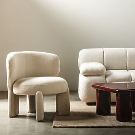 Tapicerowany fotel Elaine beżowy, boucle, zaokrąglone kształty